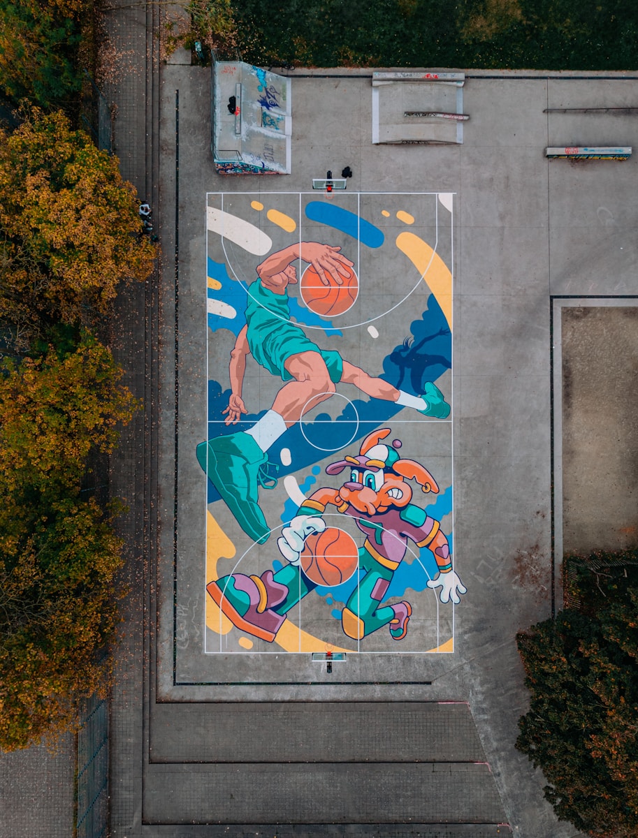 Basketball court mural with cartoon characters playing